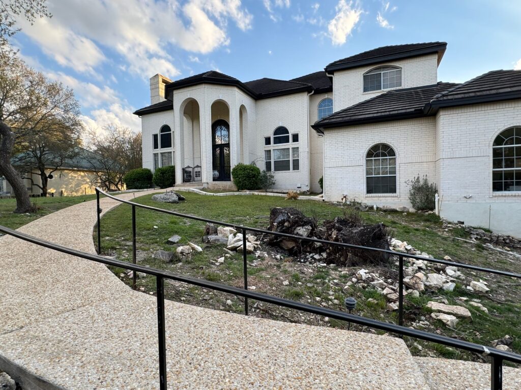 Cleaning Of The Walkway And Surrounding Grounds Including Pressure Washing Of Surfaces And Removal Of Debris