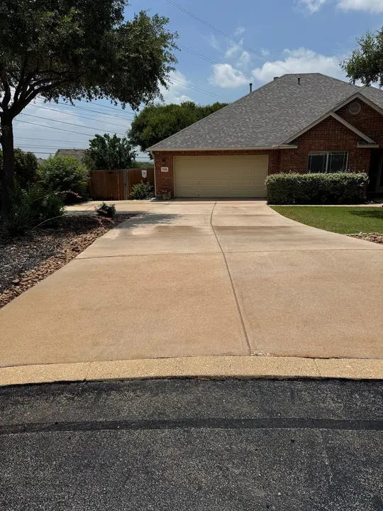 The Service Being Done Is Pressure Washing The Concrete Driveway To Remove Stains And Dirt Making It Look Clean And Refreshed
