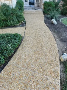 The Service Is Pressure Washing A Decorative Stone Pathway To Remove Dirt And Enhance Appearance