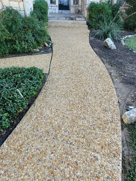 The Service Is Pressure Washing A Decorative Stone Pathway To Remove Dirt And Enhance Appearance