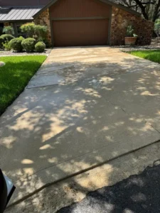The Service Shown Is Pressure Washing The Concrete Driveway To Remove Dirt And Grime For A Cleaner Appearance